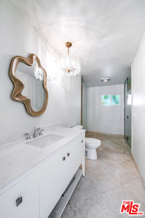 3643 Ballina Canyon Road Encino, CA 91436 - Photo 19 of 47 a bathroom with a sink and a mirror