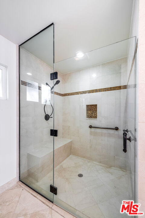 3643 Ballina Canyon Road Encino, CA 91436 - Photo 20 of 47 a bathroom with a shower and a mirror