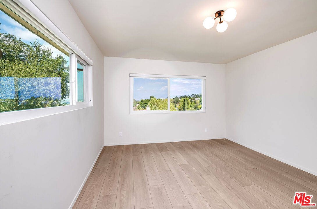 3643 Ballina Canyon Road Encino, CA 91436 - Photo 26 of 47 an empty room with a window