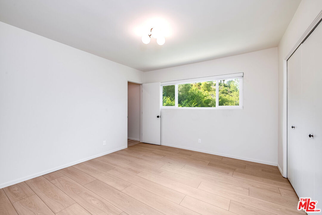3643 Ballina Canyon Road Encino, CA 91436 - Photo 27 of 47 an empty room with a window
