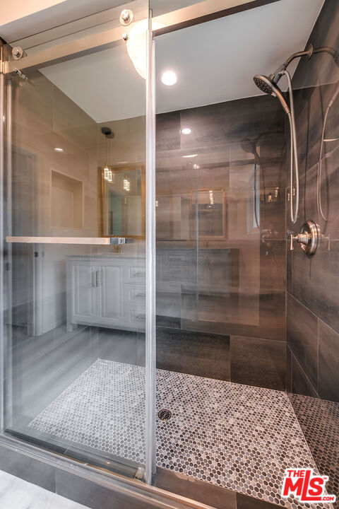 3643 Ballina Canyon Road Encino, CA 91436 - Photo 36 of 47 a bathroom with a shower