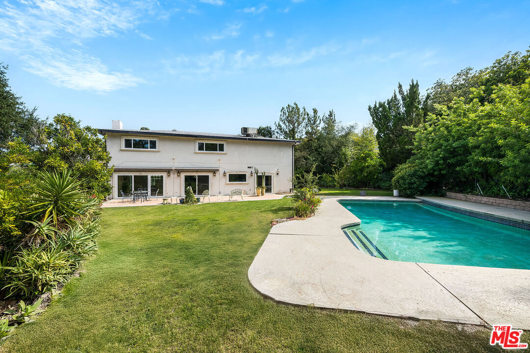 3643 Ballina Canyon Road Encino, CA 91436 - Photo 47 of 47 a aerial view of a house next to a big yard and large trees