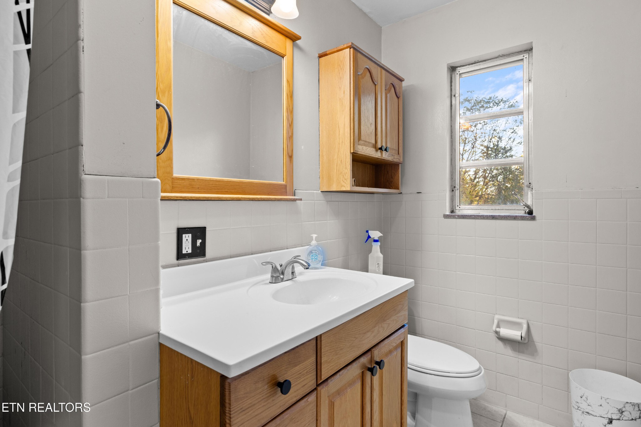 406 Overhill Road Knoxville, TN 37914 - Photo 11 of 24 a bathroom with a sink a toilet and mirror