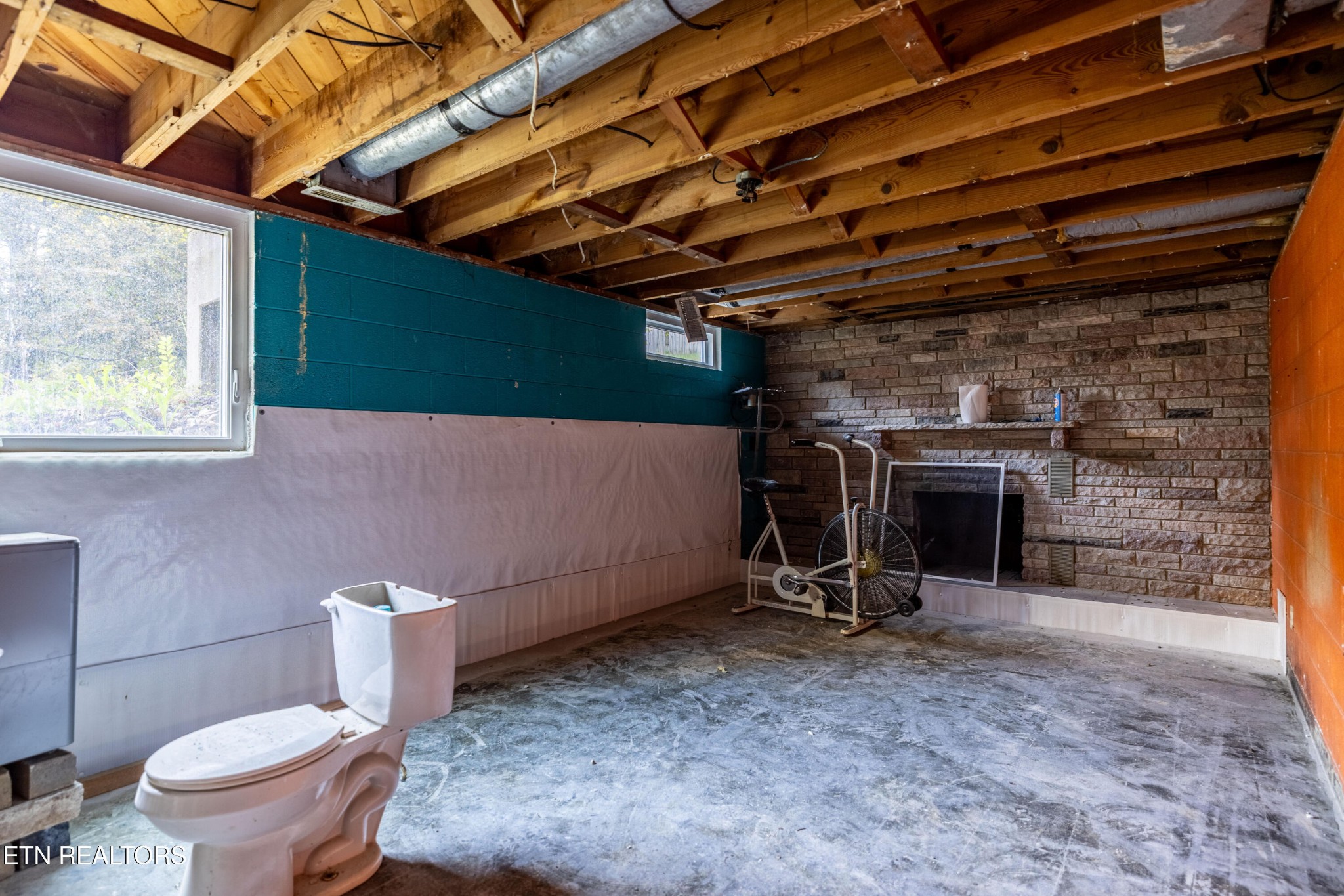 406 Overhill Road Knoxville, TN 37914 - Photo 19 of 24 a view of a room with wooden furniture and a fireplace