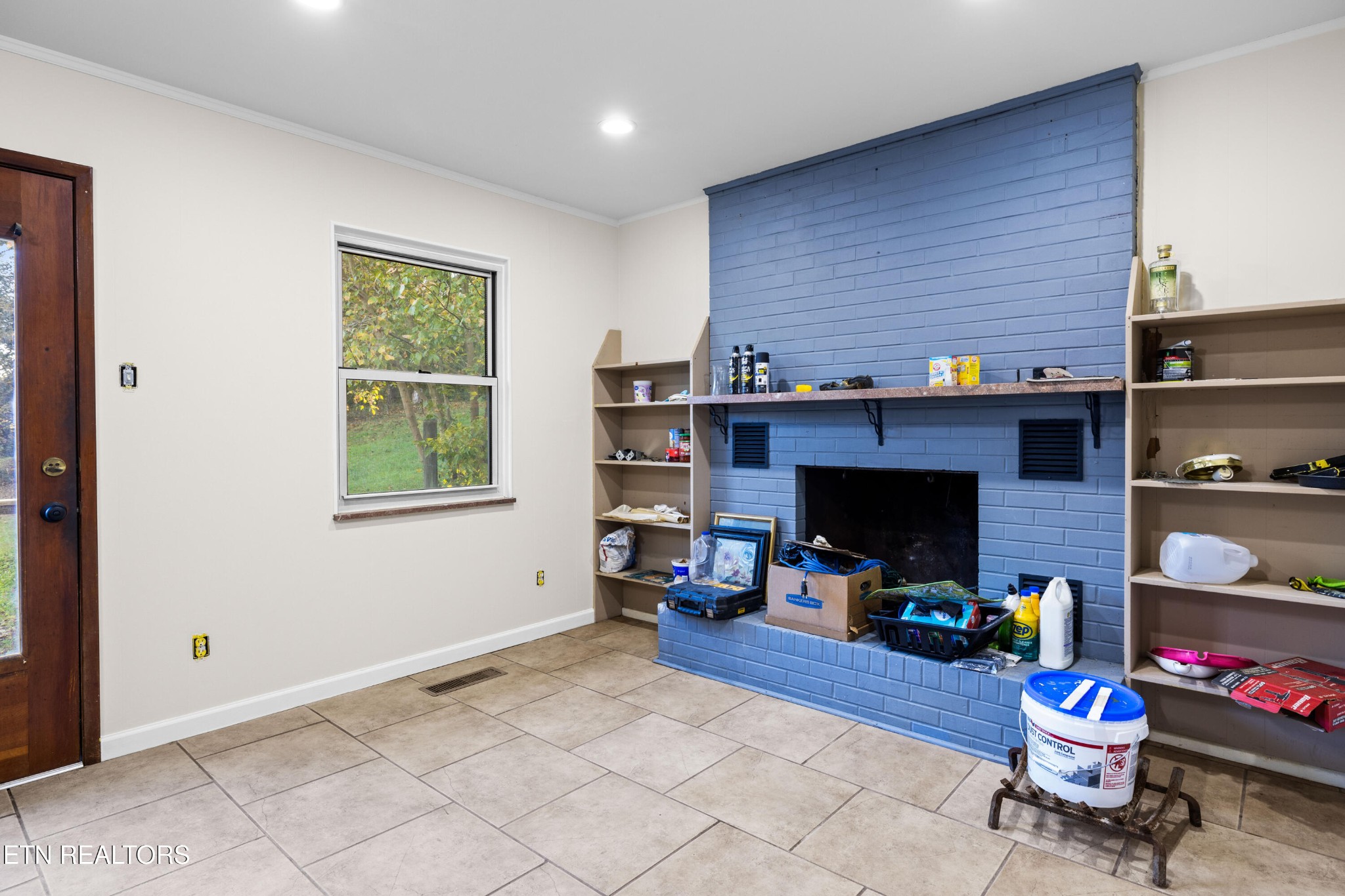 406 Overhill Road Knoxville, TN 37914 - Photo 10 of 24 a living room with furniture a flat screen tv and a fireplace