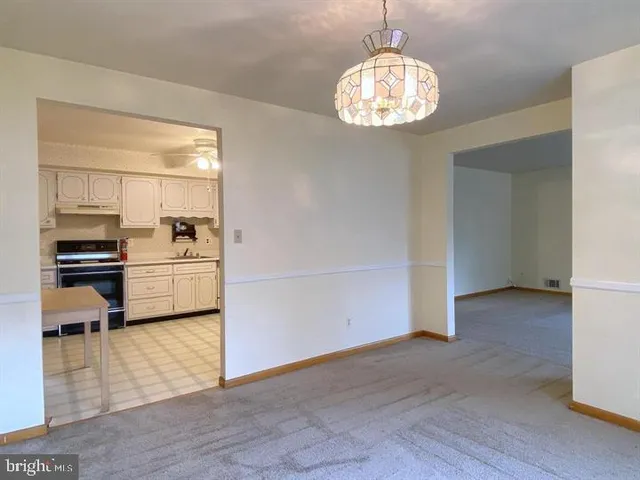 a view of a kitchen with microwave and cabinets