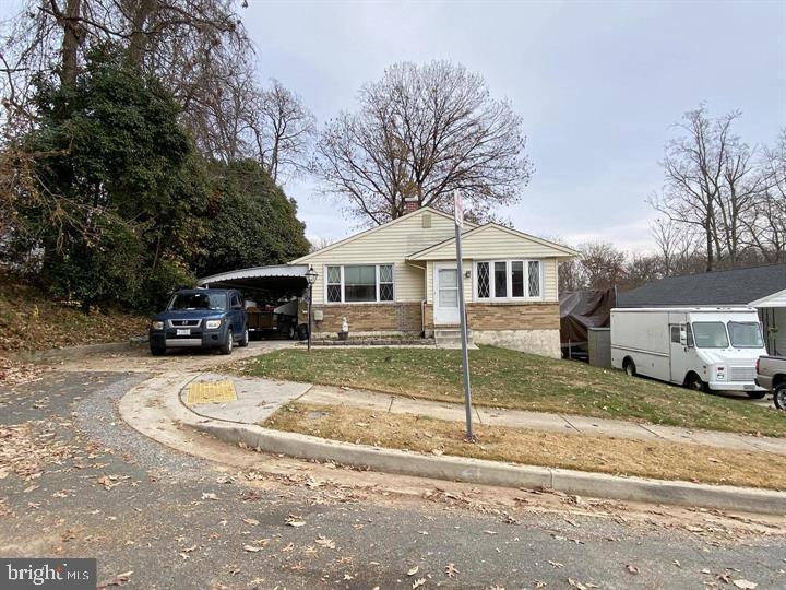 3300 Upton Road Baltimore, MD 21234 - Photo 3 of 40 a front view of a house with a yard