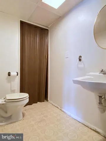 a kitchen with a sink and refrigerator