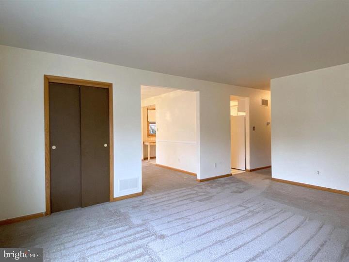 3300 Upton Road Baltimore, MD 21234 - Photo 8 of 40 a view of an empty room with wooden floor & closet