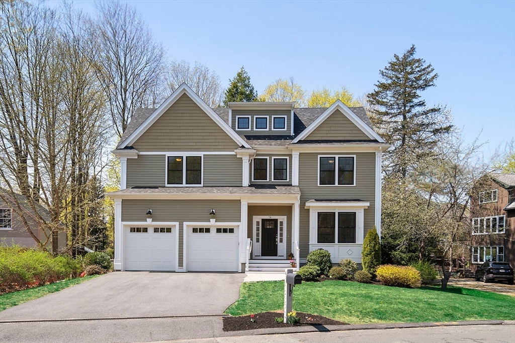 16 Cedar Street Lexington, MA 02421 - Photo 2 of 2 a front view of a house with a garden and plants