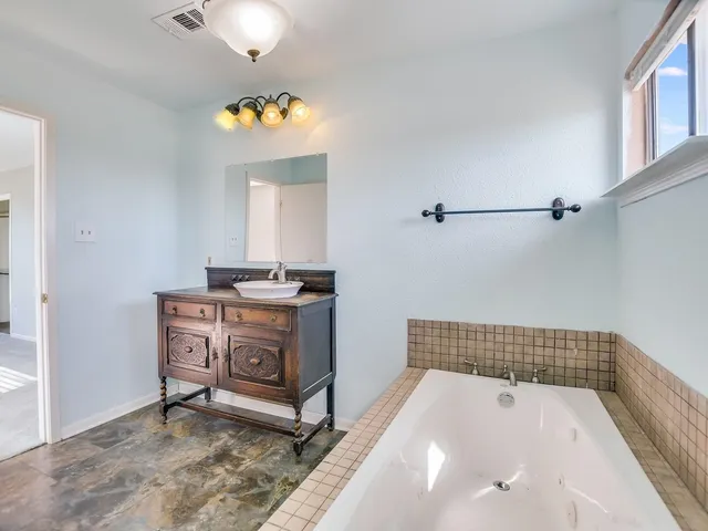 a bathroom with a sink and a bathtub