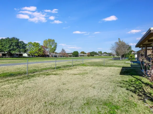 a view of a golf course with a lake