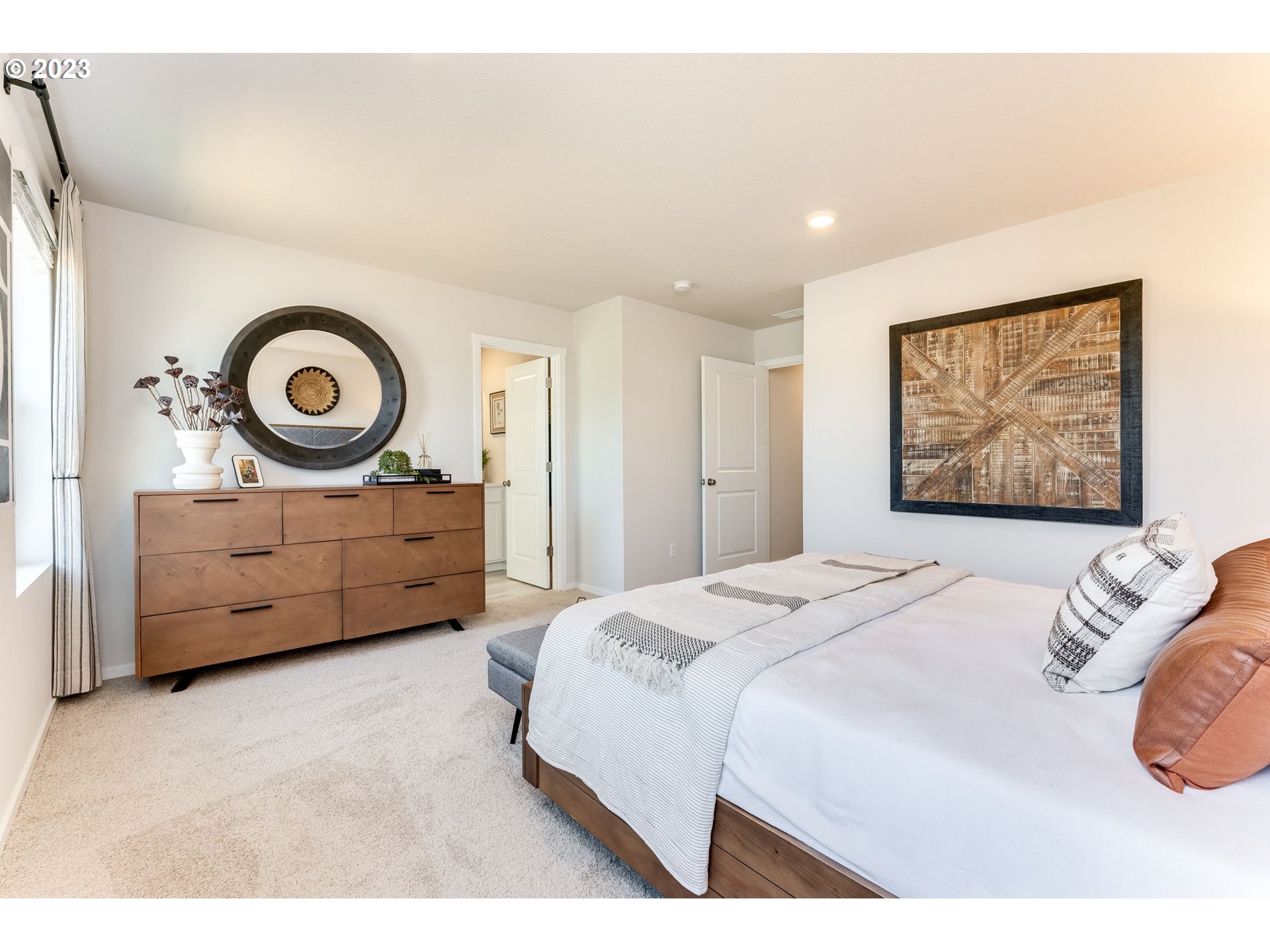 1006 Northwest 175th Way Ridgefield, WA 98642 - Photo 24 of 27 a bedroom with a bed and a lamp