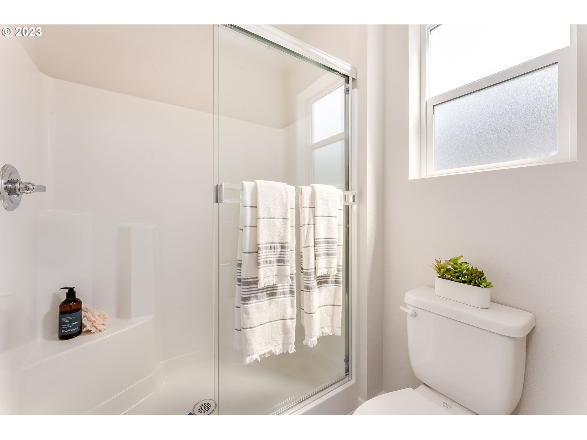 1006 Northwest 175th Way Ridgefield, WA 98642 - Photo 26 of 27 a bathroom with a toilet and a shower