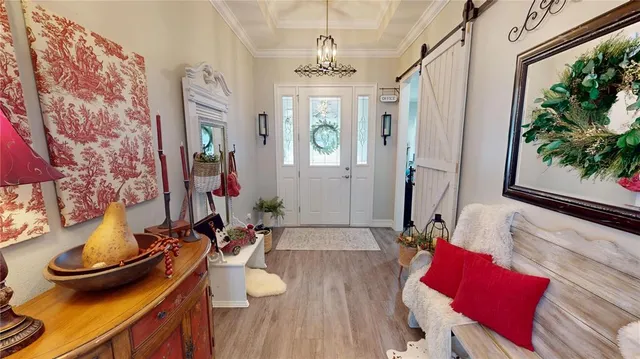 a kitchen with stainless steel appliances granite countertop a sink and a white cabinets