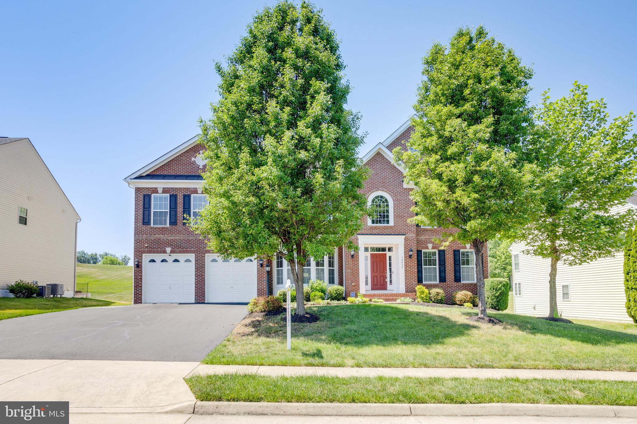 18475 Kerill Road Triangle, VA 22172 - Photo 25 of 99 a front view of a house with a yard