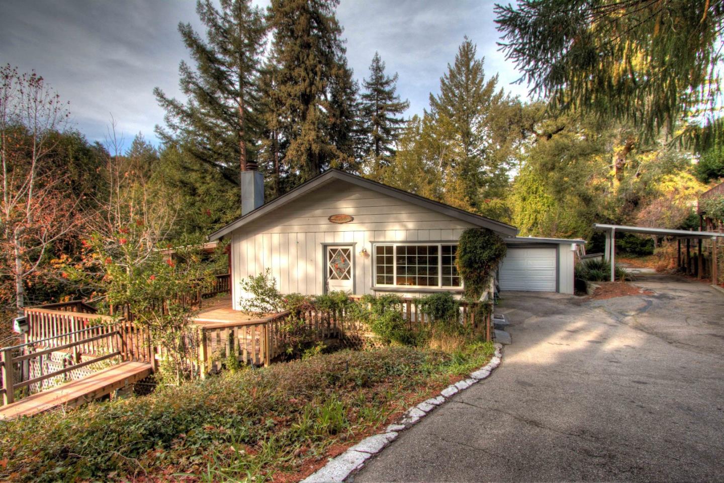 a front view of a house with yard and green space