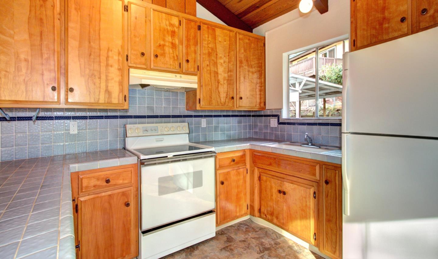 115 Estates Drive Ben Lomond, CA 95005 - Photo 4 of 13 a kitchen with granite countertop cabinets stainless steel appliances and a window