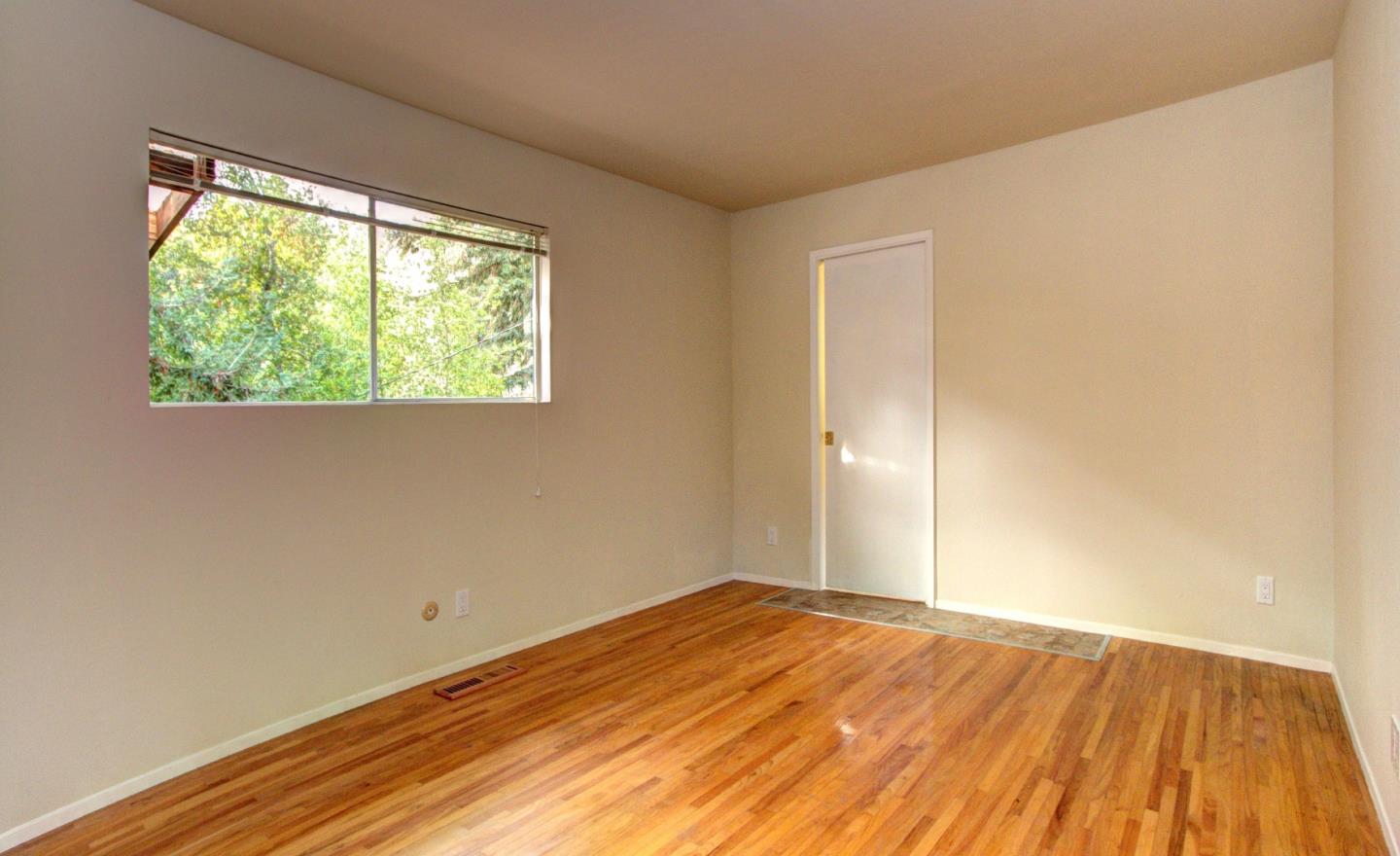 115 Estates Drive Ben Lomond, CA 95005 - Photo 6 of 13 a view of empty room with wooden floor and fan