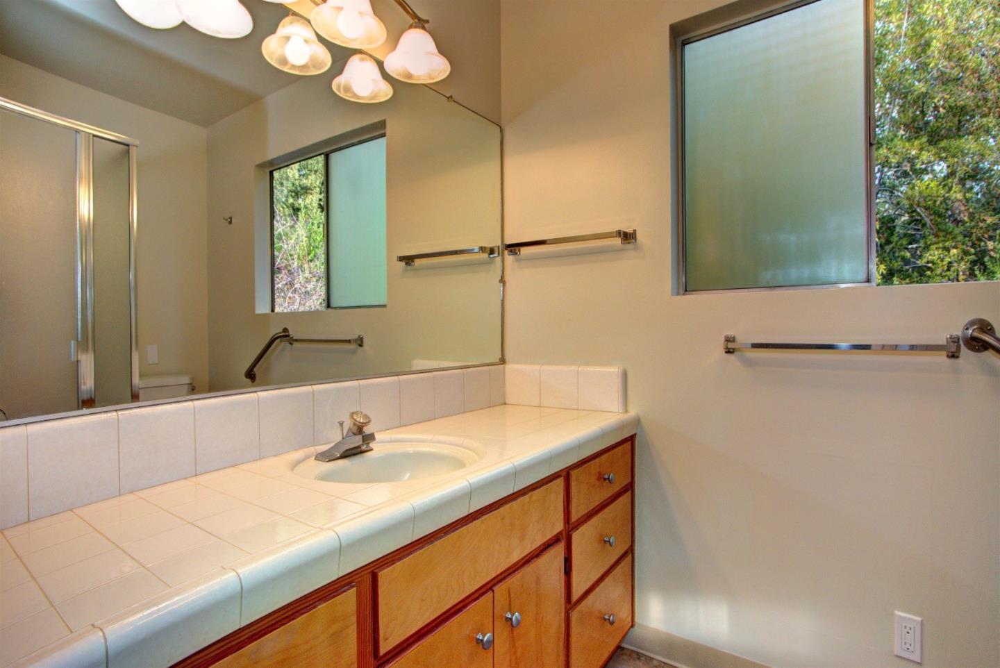 115 Estates Drive Ben Lomond, CA 95005 - Photo 7 of 13 a bathroom with a sink and a mirror