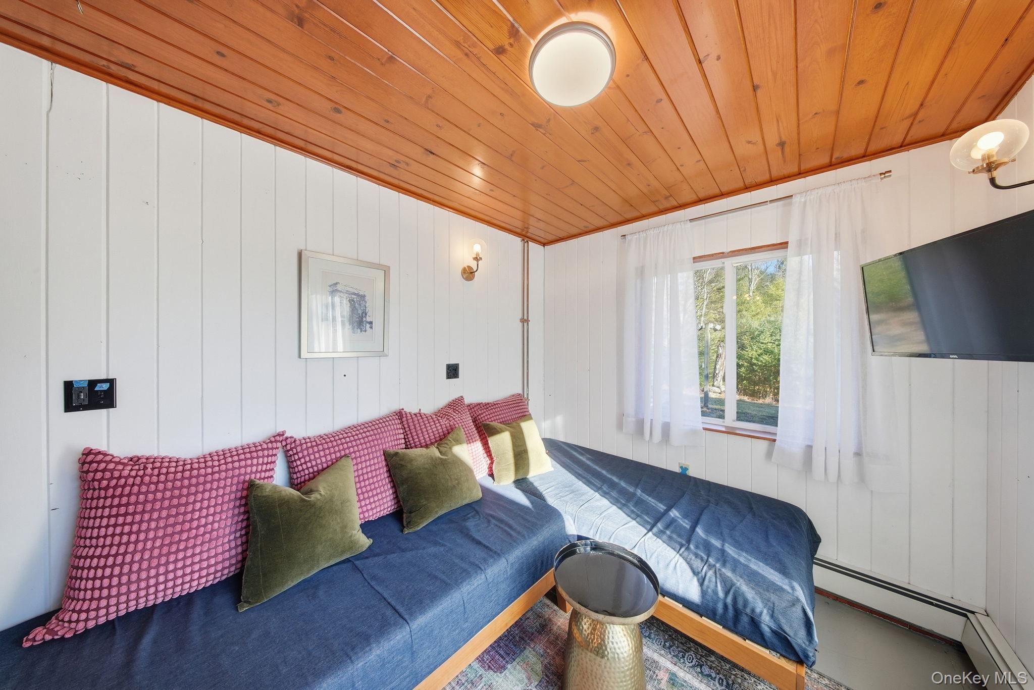 136 Barryville - Yulan Road Barryville, NY 12719 - Photo 18 of 37 Bedroom with wooden ceiling, wood walls, and baseboard heating