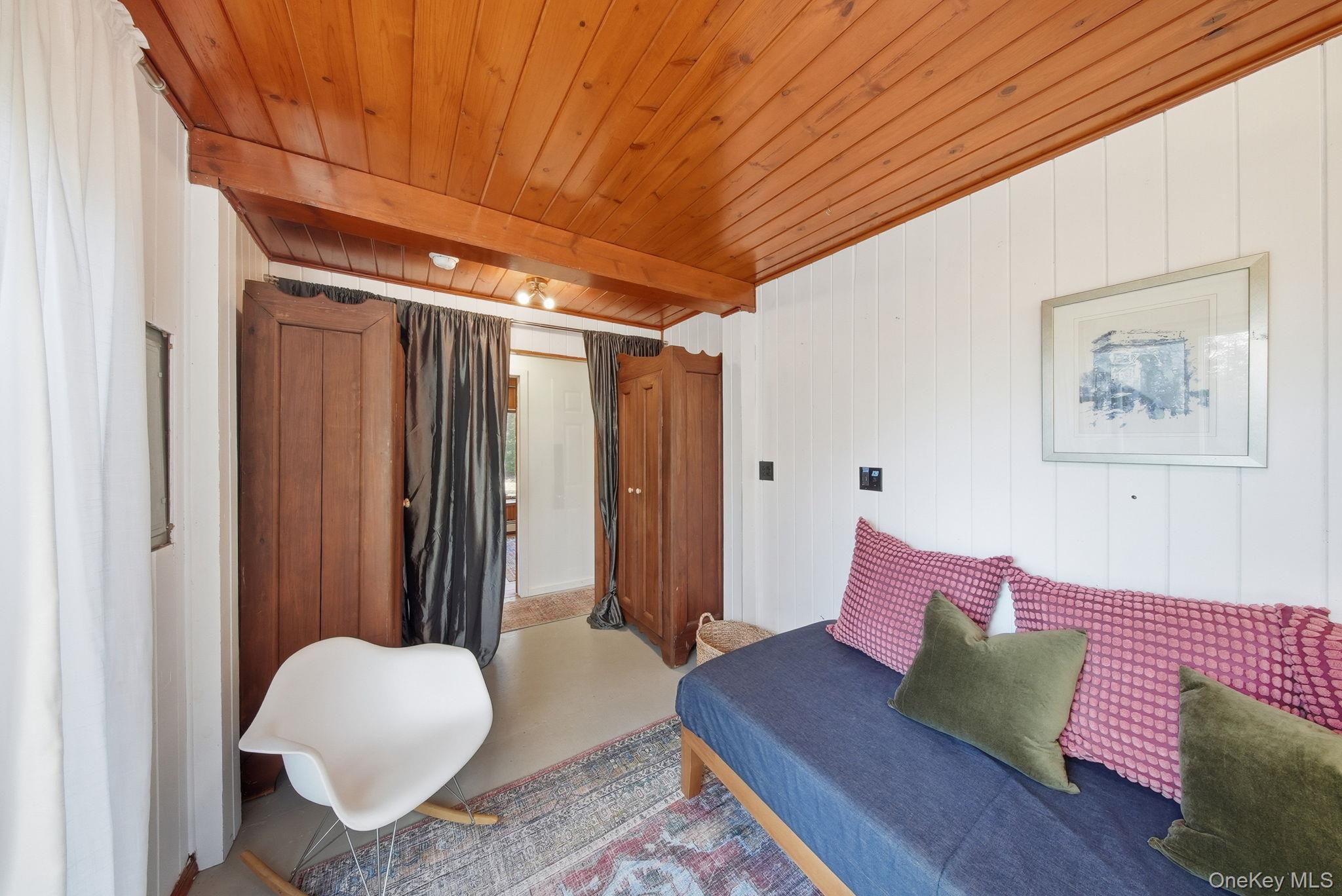 136 Barryville - Yulan Road Barryville, NY 12719 - Photo 19 of 37 Bedroom featuring wooden walls and a wood ceiling with exposed beams