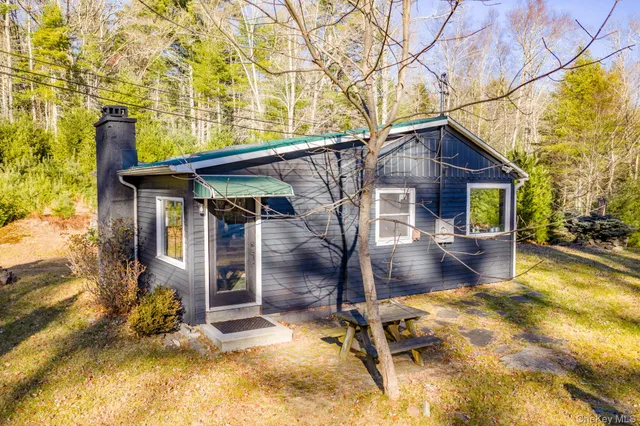 a view of house with a patio