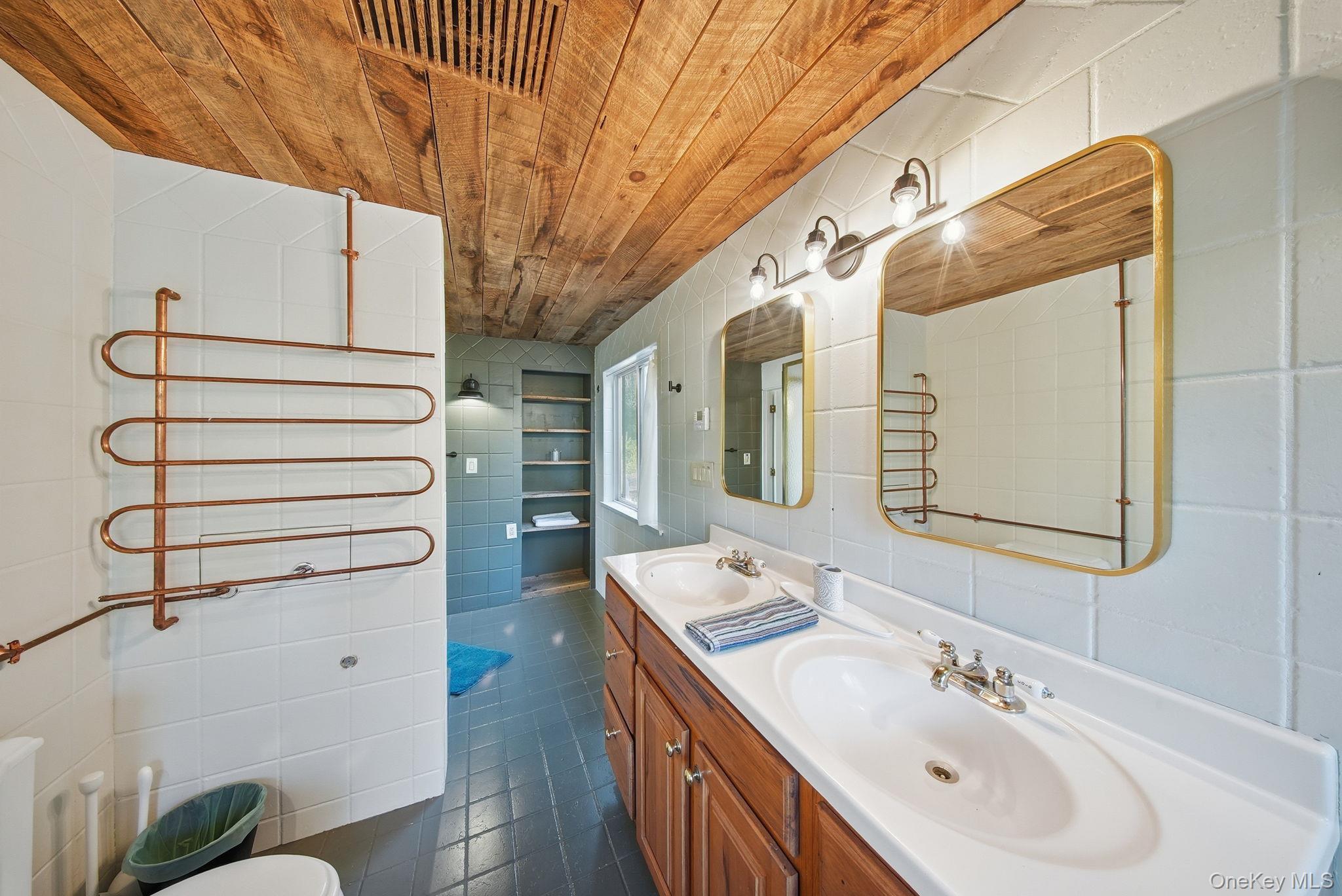 136 Barryville - Yulan Road Barryville, NY 12719 - Photo 24 of 37 Full bath featuring wooden ceiling, double vanity, tile walls, and a towel warming rack