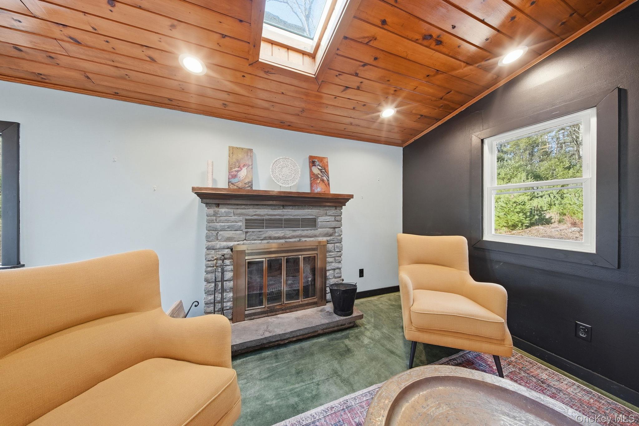 136 Barryville - Yulan Road Barryville, NY 12719 - Photo 6 of 37 Sitting room featuring wood ceiling, recessed lighting, a fireplace, vaulted ceiling, and crown molding
