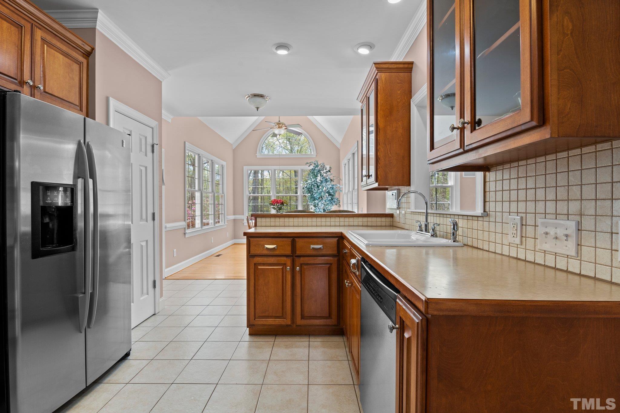 325 Onie Burton Road Rougemont, NC 27572 - Photo 7 of 39 a kitchen with stainless steel appliances granite countertop a sink and a refrigerator