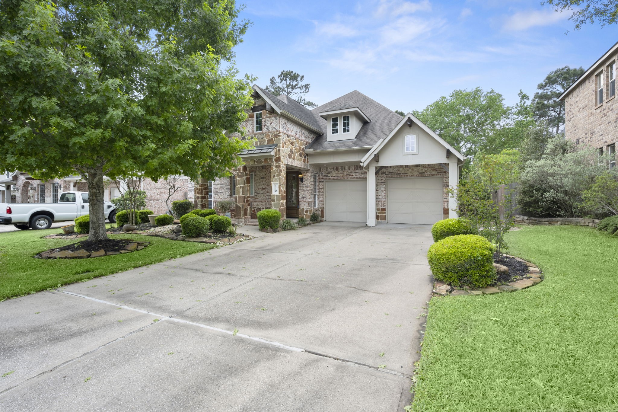 110 David Forest Lane Conroe, TX 77384 - Photo 2 of 35 a front view of a house with a yard