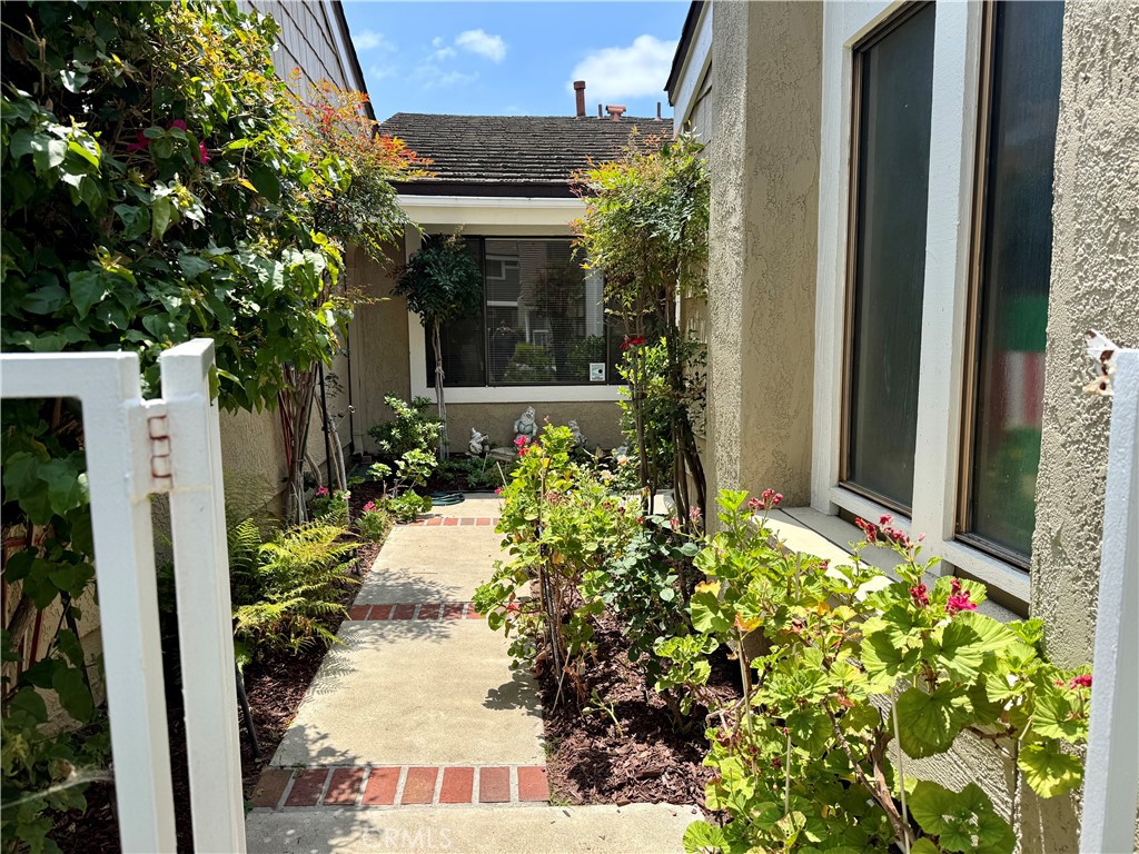 8 Coldstream Irvine, CA 92604 - Photo 3 of 27 a view of a house with potted plants