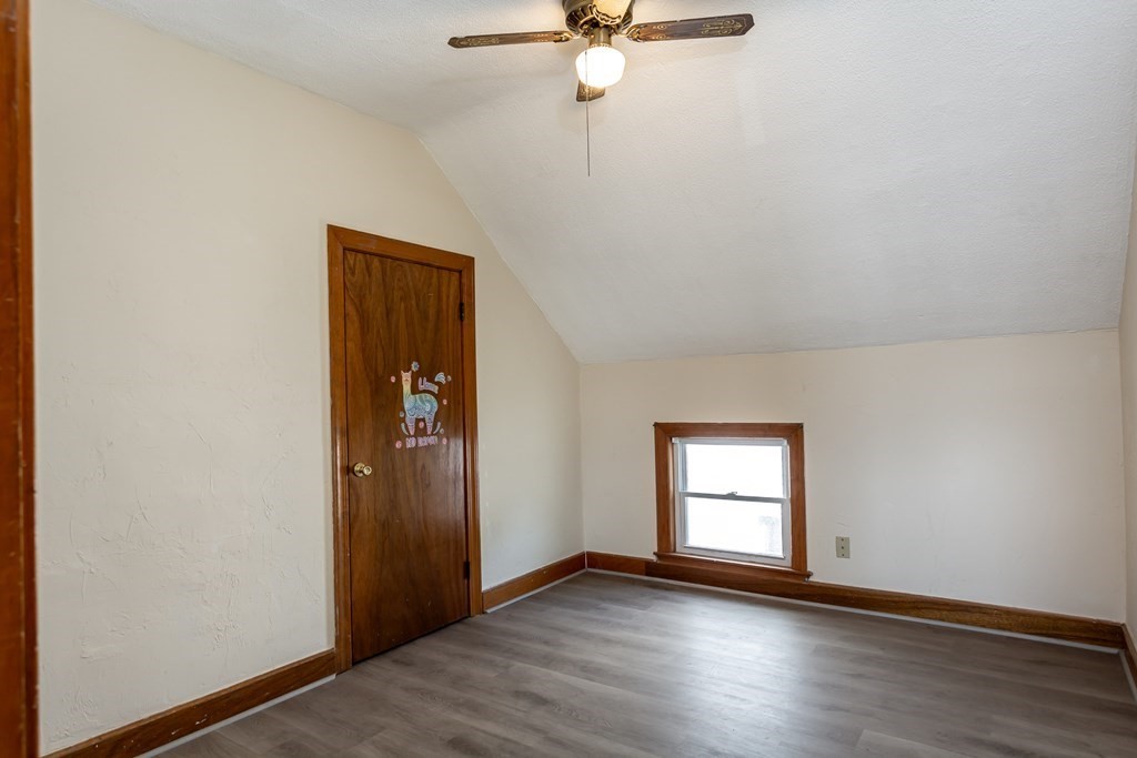325 Hope Street Fall River, MA 02721 - Photo 29 of 34 an empty room with wooden floor closet and windows