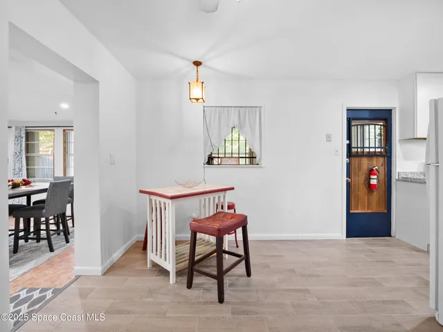 a view of a livingroom with furniture and wooden floor