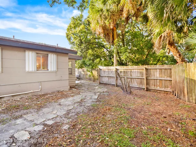 a view of backyard with tree