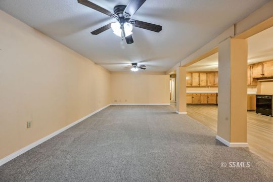 418 North Inyo Street Ridgecrest, CA 93555 - Photo 21 of 35 wooden floor in an empty room with a window