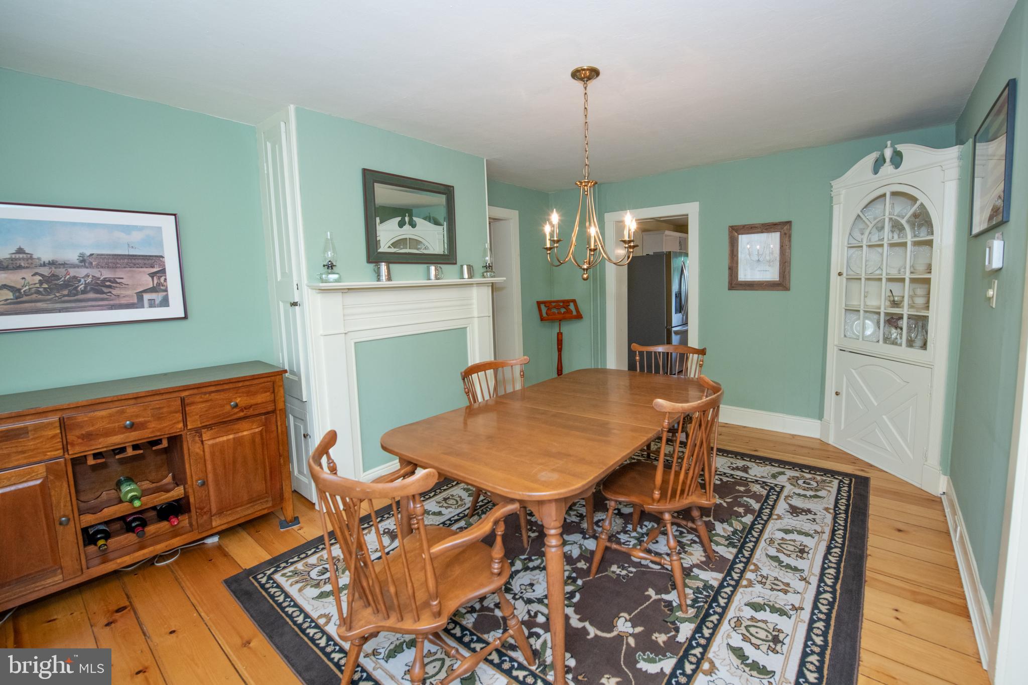 107 Stoopville Road Newtown, PA 18940 - Photo 19 of 60 a view of a dining room with furniture a rug and wooden floor