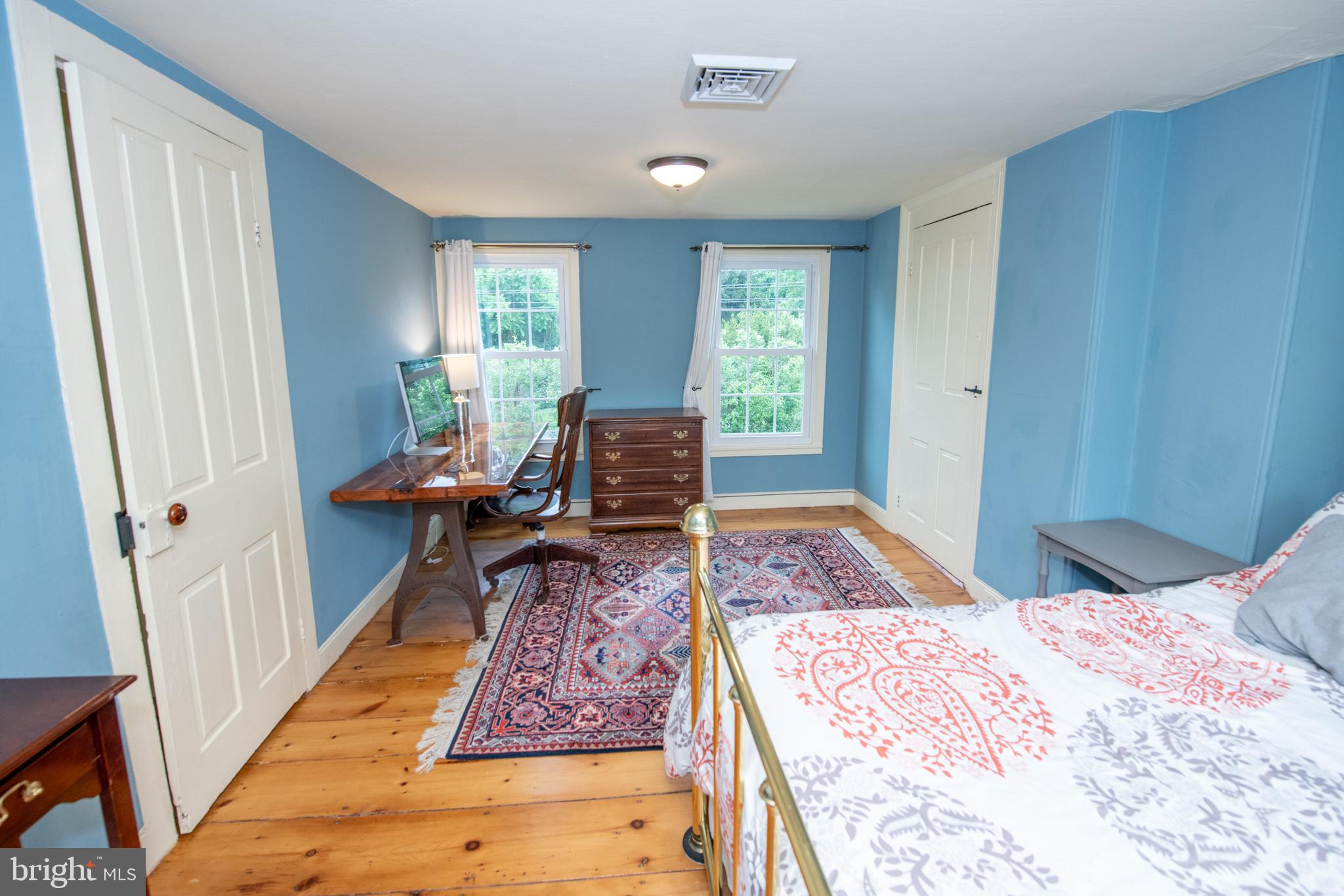 107 Stoopville Road Newtown, PA 18940 - Photo 29 of 60 a bedroom with a bed and wooden floor