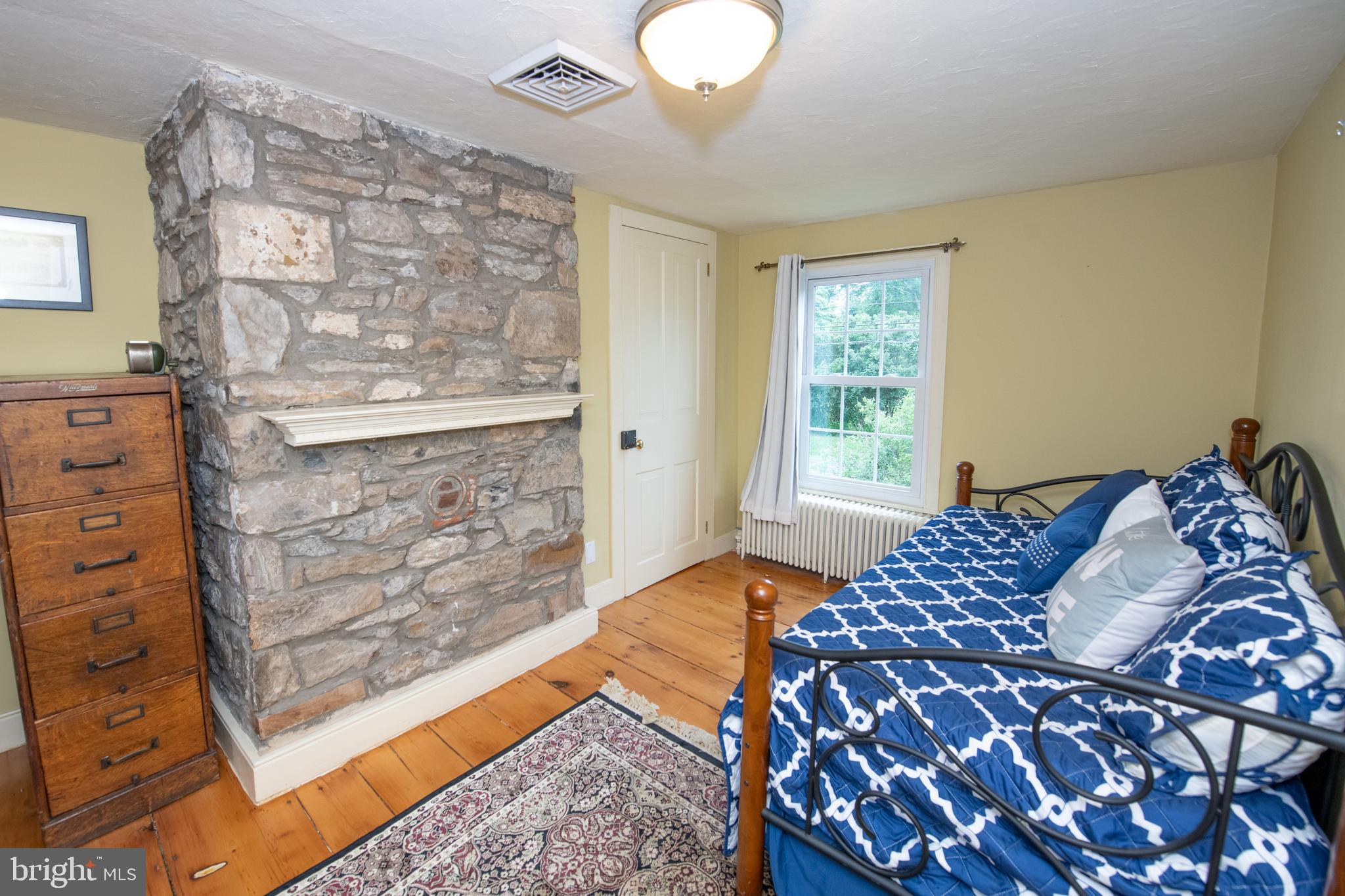 107 Stoopville Road Newtown, PA 18940 - Photo 32 of 60 a bedroom with a bed and a dresser