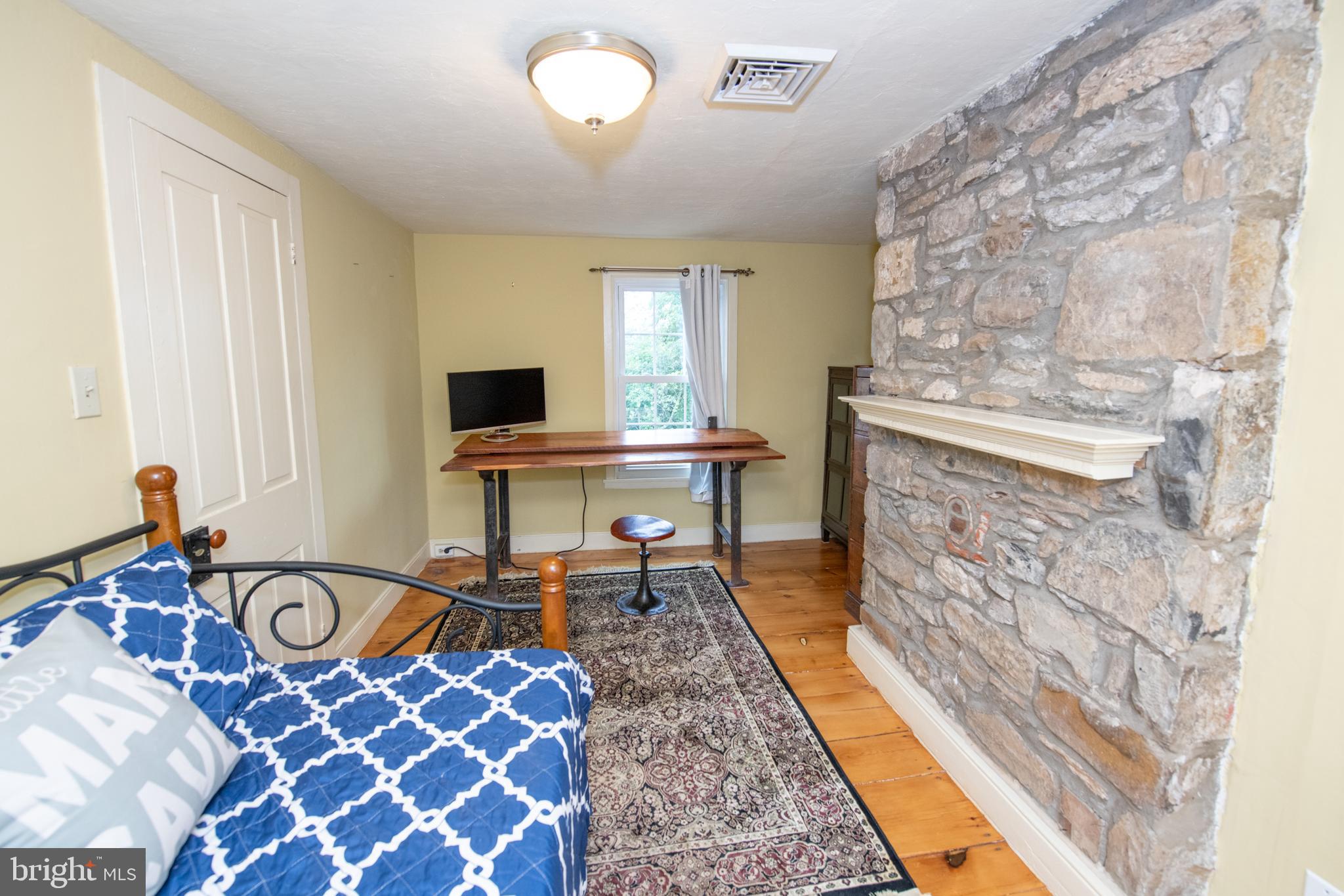107 Stoopville Road Newtown, PA 18940 - Photo 34 of 60 a living room with furniture and a fireplace