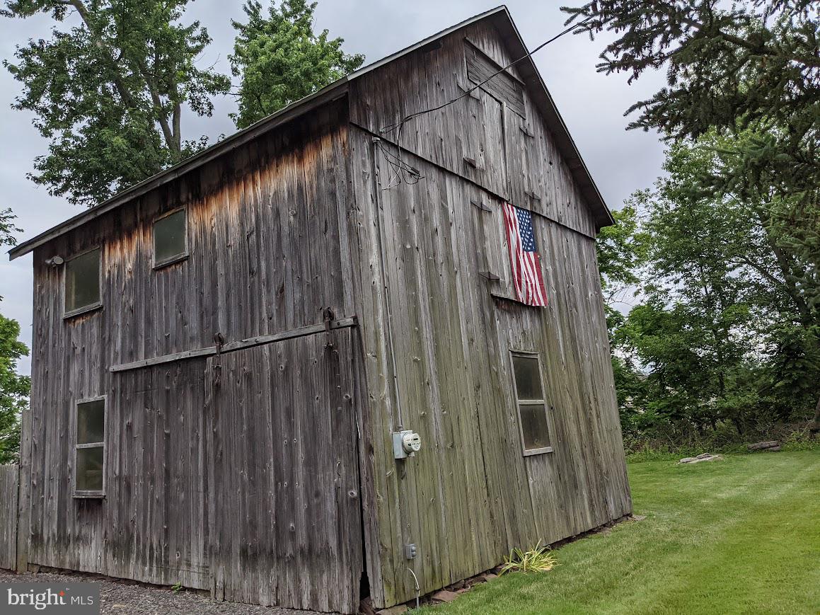 107 Stoopville Road Newtown, PA 18940 - Photo 37 of 60 a view of a small house with backyard