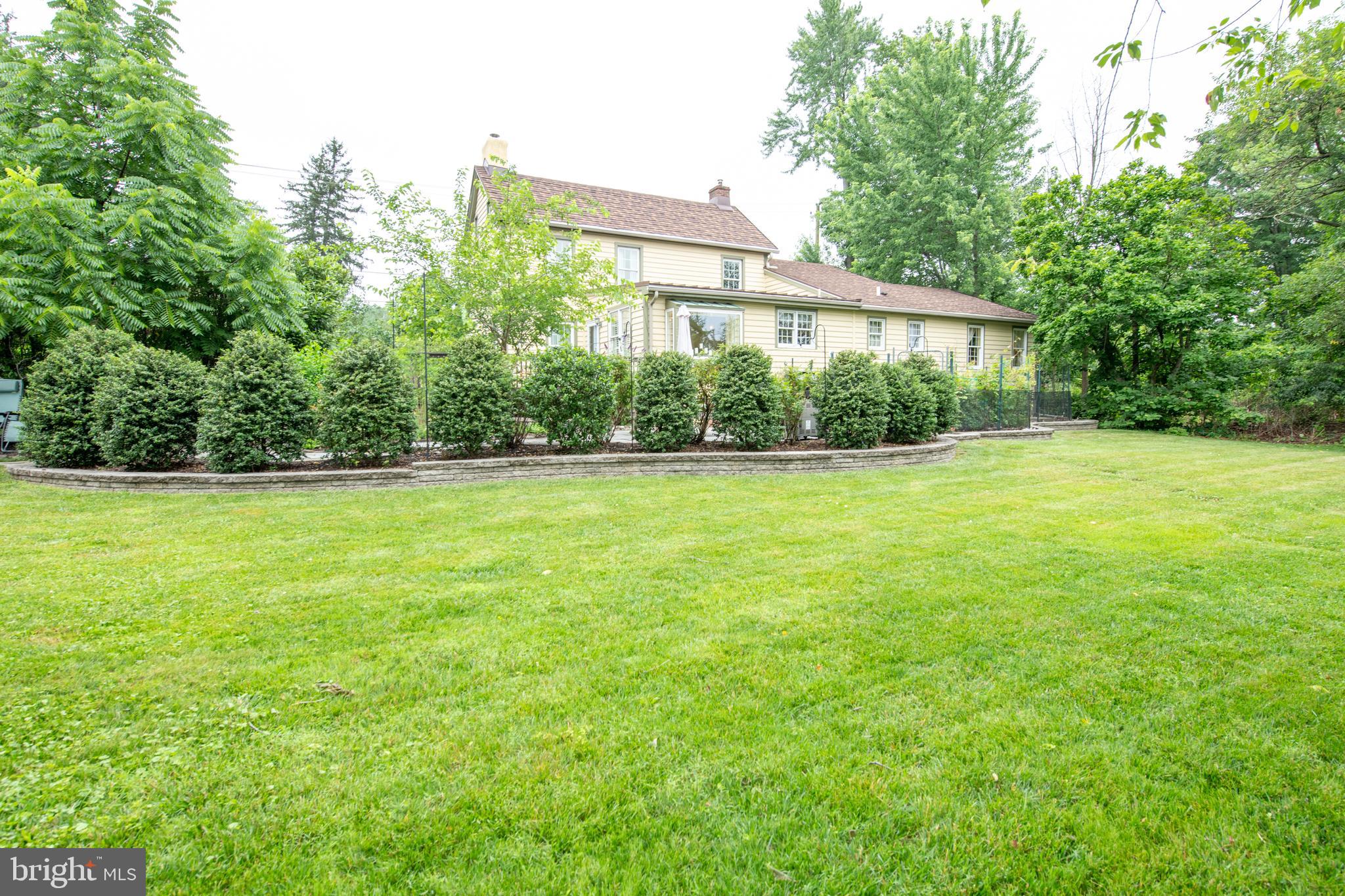 107 Stoopville Road Newtown, PA 18940 - Photo 45 of 60 a view of a trees in a yard with a house