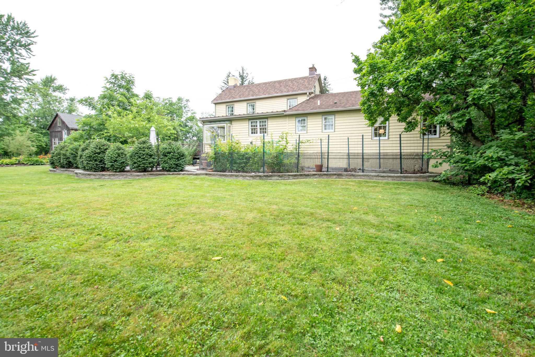 107 Stoopville Road Newtown, PA 18940 - Photo 46 of 60 a view of a house with a yard and a large tree