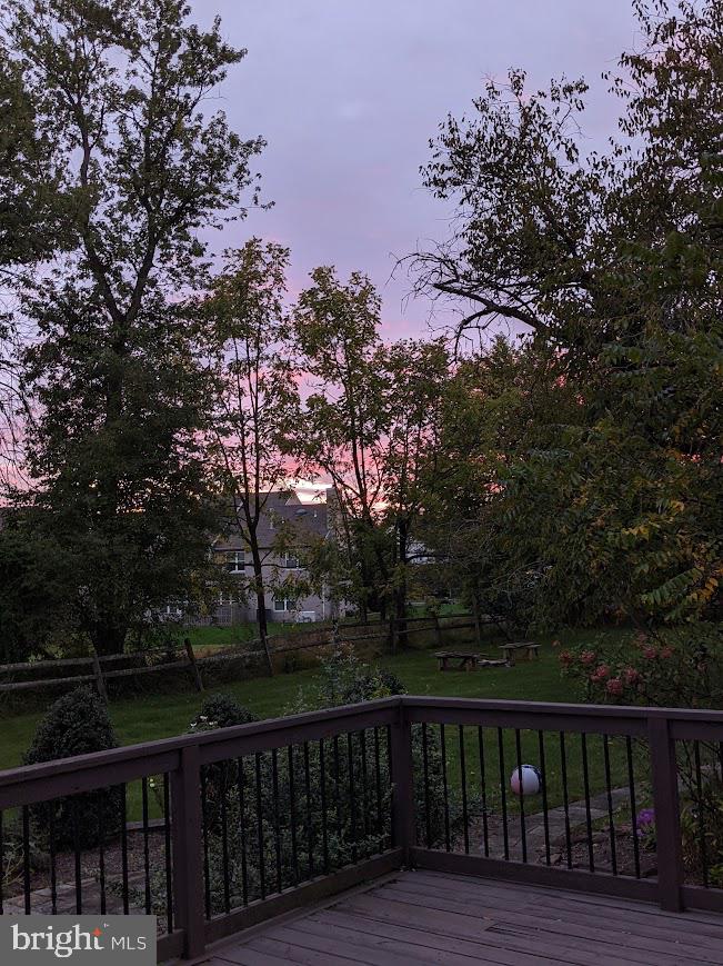 107 Stoopville Road Newtown, PA 18940 - Photo 53 of 60 a wooden deck with sunset view