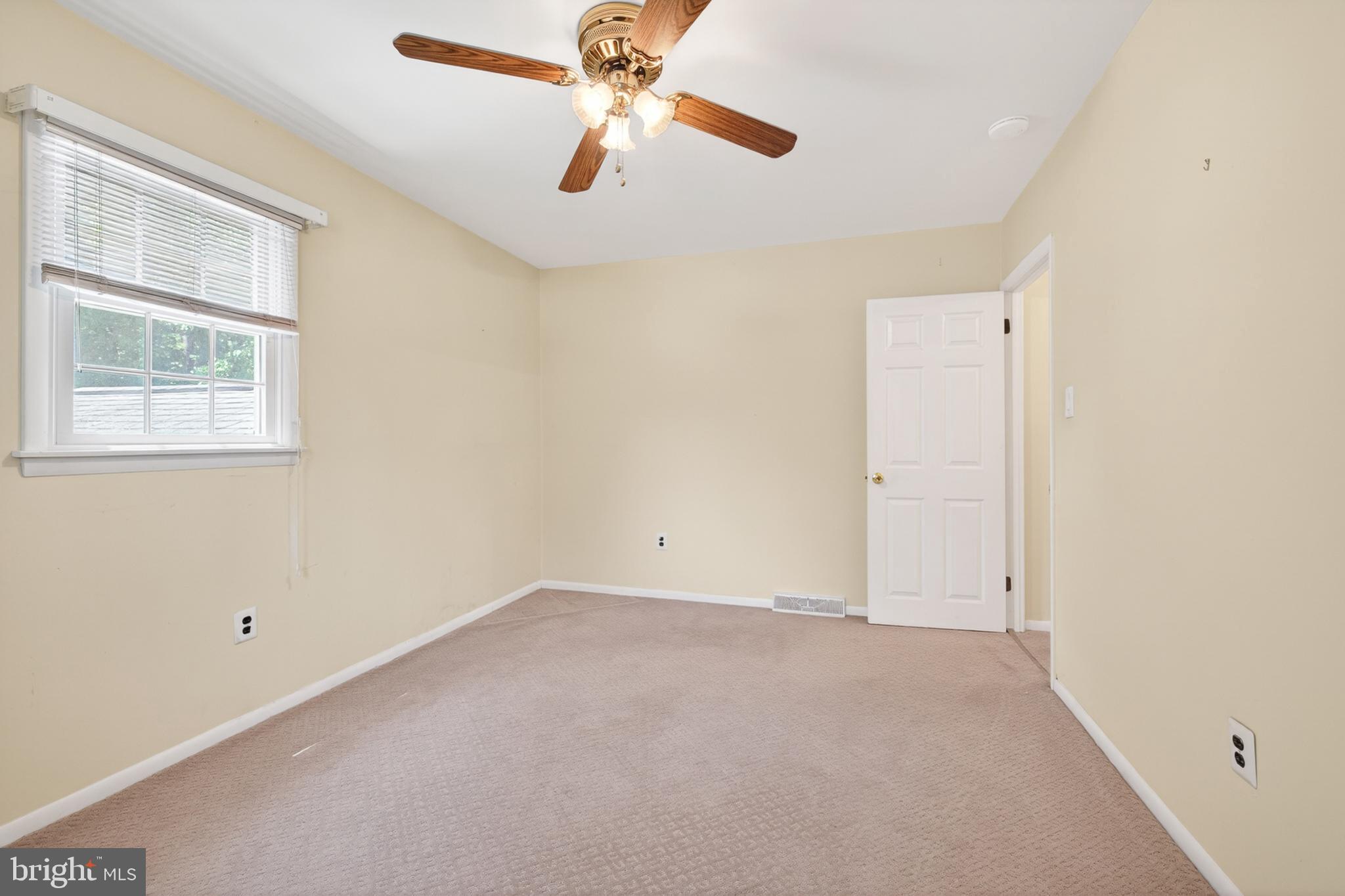 3701 Ebright Road Chadds Ford, PA 19317 - Photo 28 of 45 an empty room with windows and fan