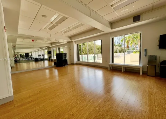 a view of a living room with hardwood floor