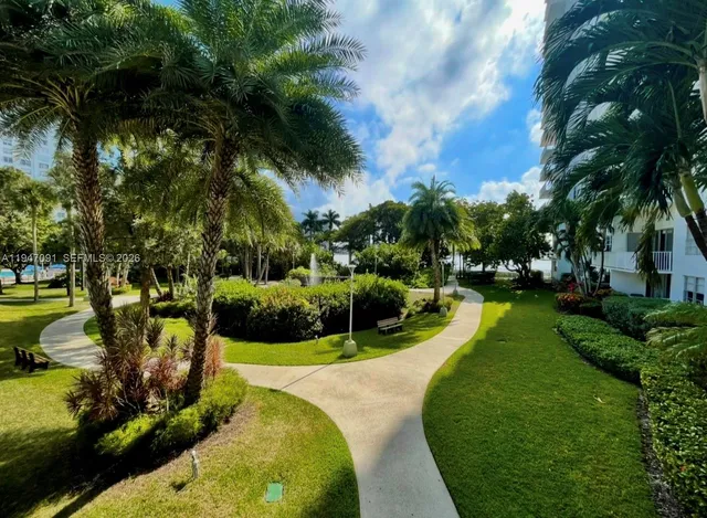 a view of a swimming pool with a garden