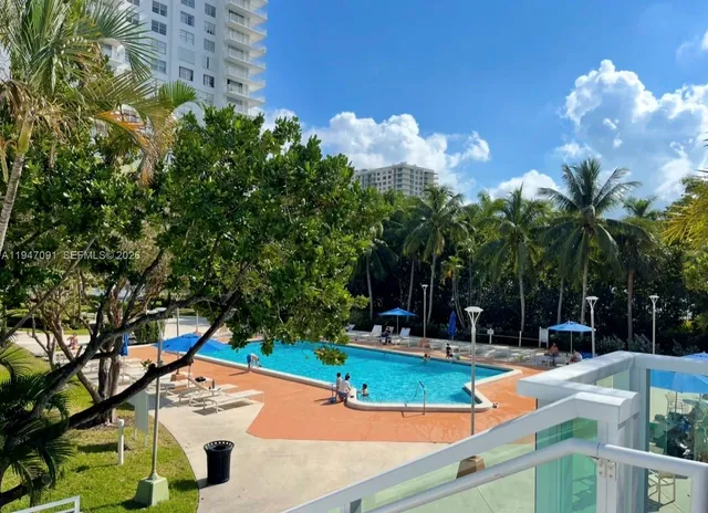 a view of swimming pool with a yard