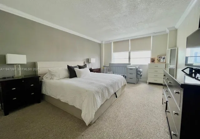 a bedroom with bed and a window