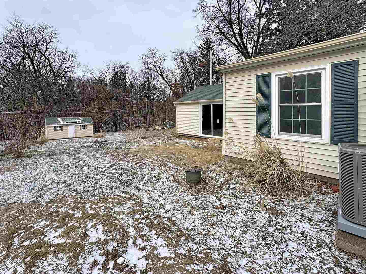1213 29th Ave Court Moline, IL 61265 - Photo 16 of 17 a house with trees in the background